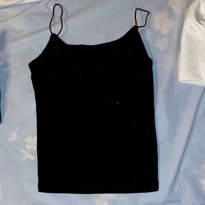 Black crop top with built in bra size small fits like a one size fits all.